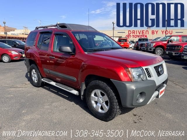 2012 Nissan Xterra S in Red — front three-quarter view