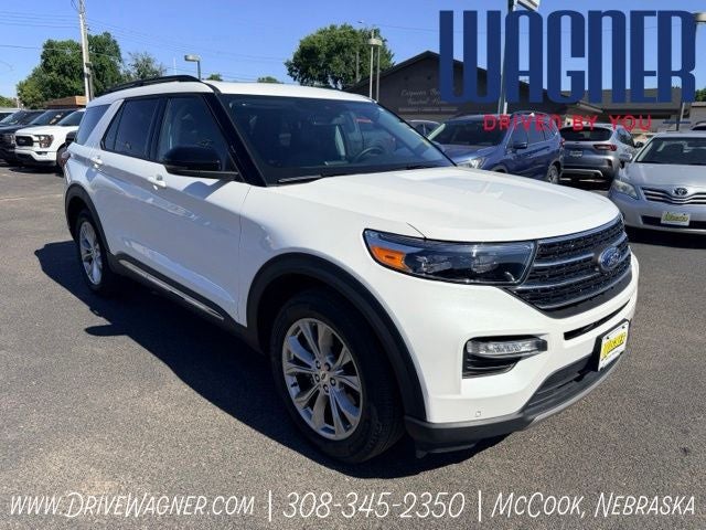 2024 Ford Explorer XLT in Star White Metallic Tri-Coat — front three-quarter view