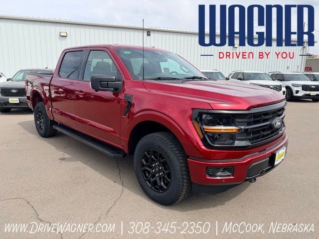 2026 Ford F-150 XLT in Ruby Red Metallic Tinted Clearcoat — front three-quarter view