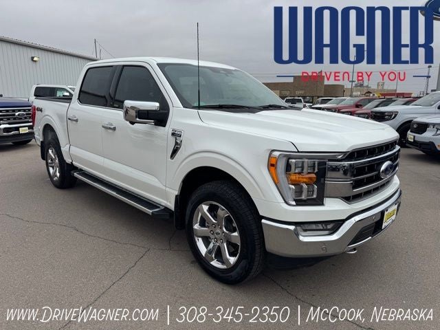 2023 Ford F-150 Lariat in White Metallic — front three-quarter view