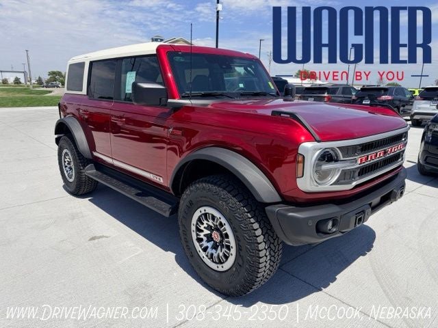 2026 Ford Bronco Outer Banks in Ruby Red Metallic Tinted Clearcoat — front three-quarter view